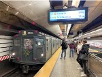 The second holiday train trip of the day is about to depart Lexington Ave-63 Street heading down to 2nd Ave Station